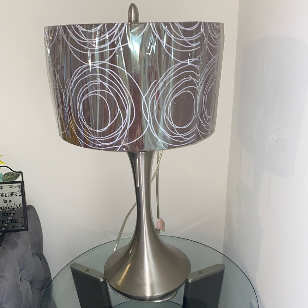 Two silver lamps with brown and white lamp shade